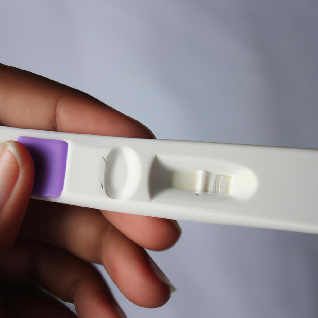 Person holding pregnancy test kit